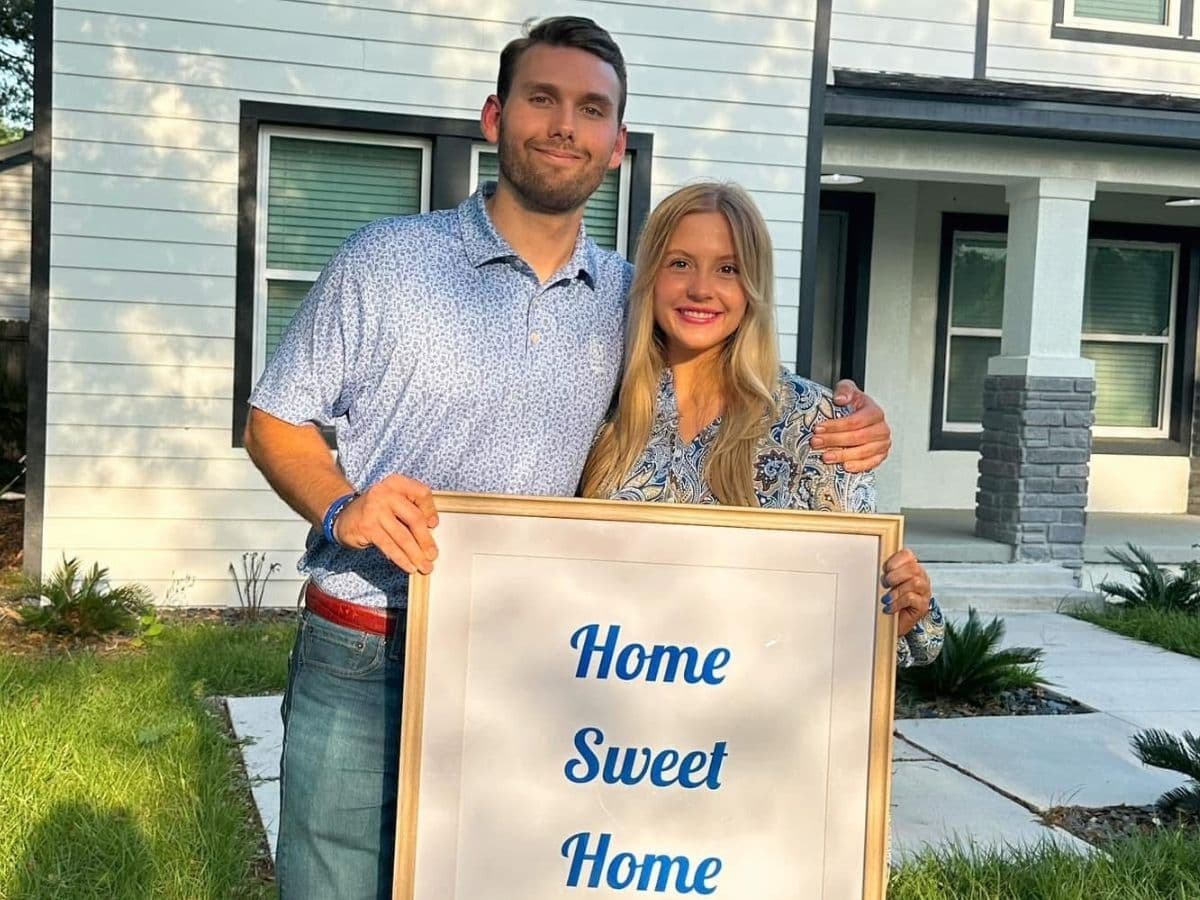 Camryn and her partner on move-in day outside their new Orlando home.