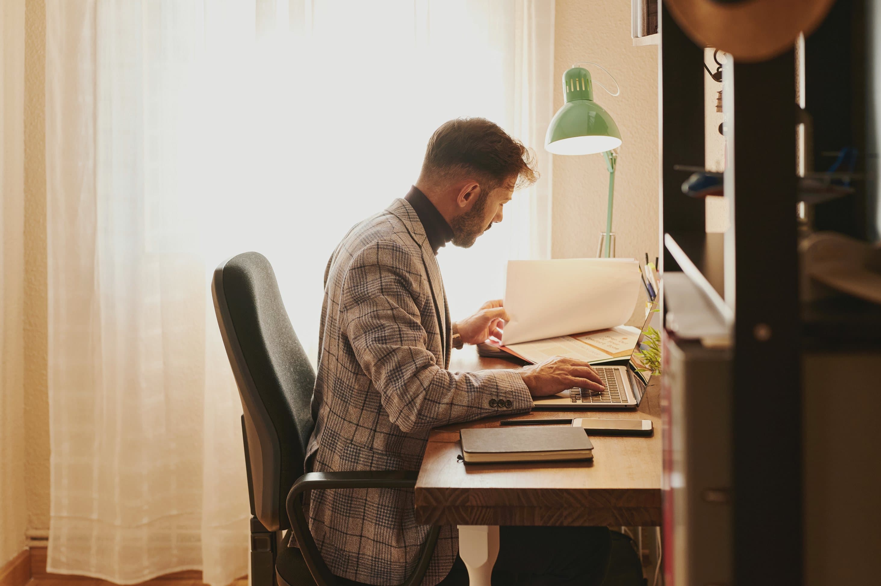 A Florida buyer reviewing jumbo loan documentation and reserves at a desk