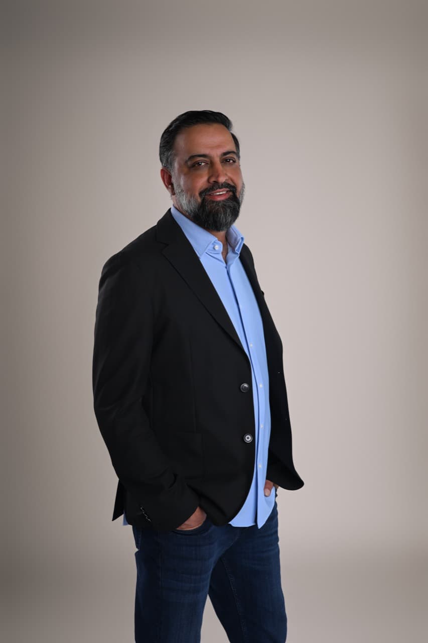 Shahram Sondi in a black blazer and blue shirt