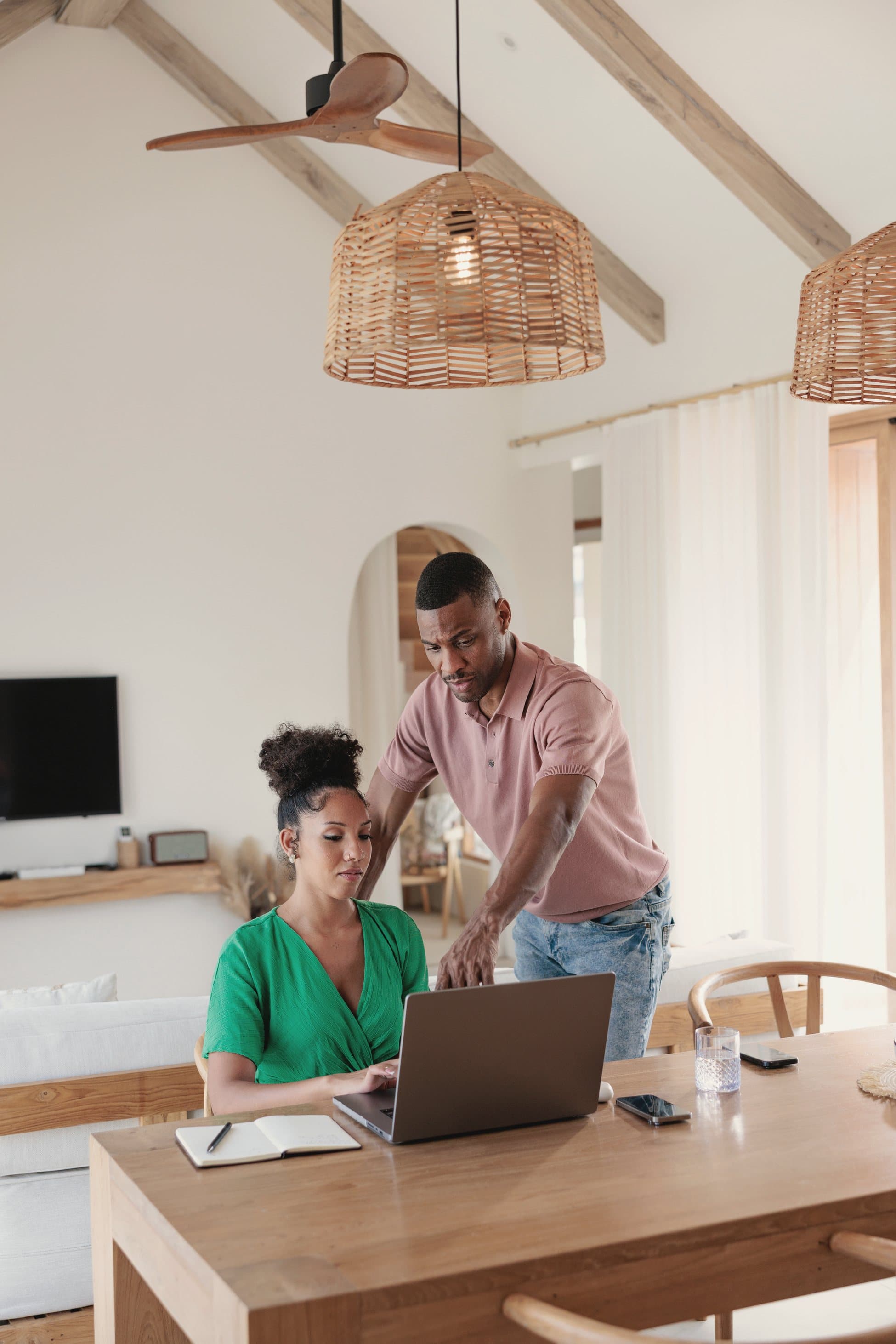 Florida homebuyers reviewing their mortgage options together on a laptop